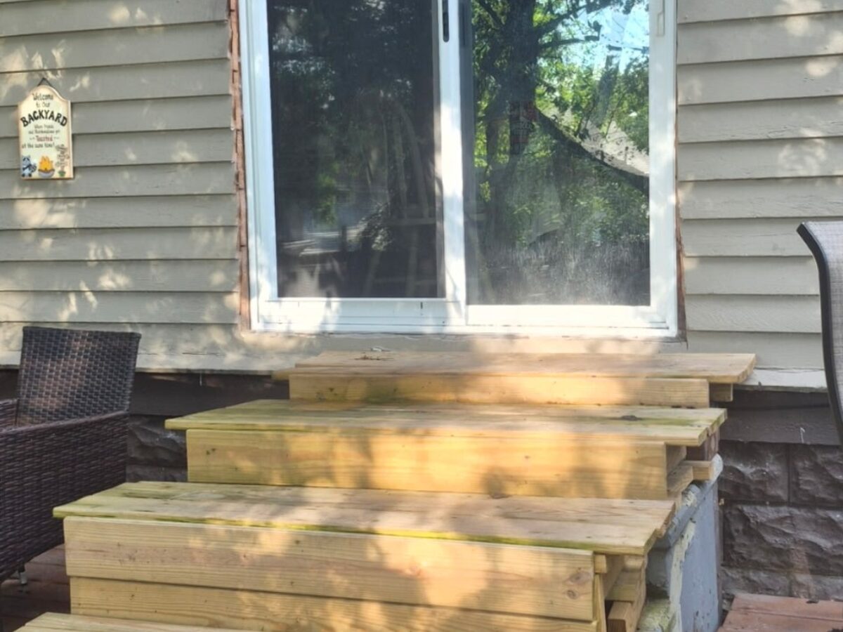 Before: unfinished exterior trim around a new sliding door